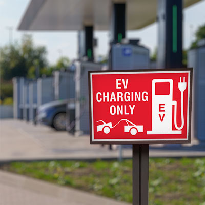 ev charging only sign blurred background image