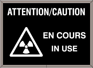 ATTENTION/CAUTION EN COURS IN USE w/Caution Symbol Image